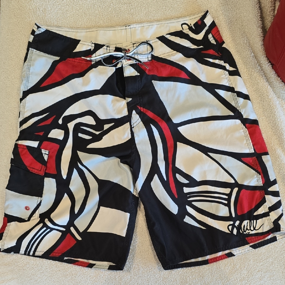 O'Neill Black and Red Board Shorts with Geometric Design